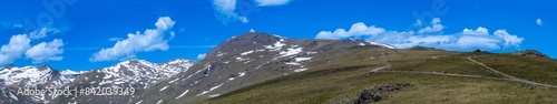 Panoramic view on snowy mountains on hiking trail to Mulhacen peak in the spring, Sierra Nevada range, Andalusia, Spain