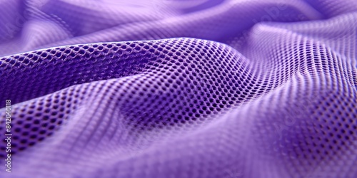 Abstract texture closeup of purple athletic fabric showcasing intricate patterns and mesh structure perfect for backgrounds and wallpapers