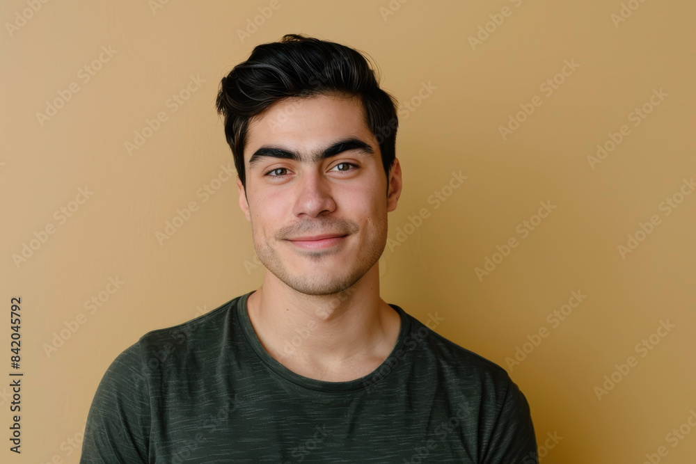 Fototapeta premium A close up portrait of a young man with a subtle smile