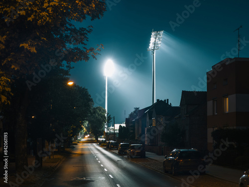 Obraz na płótnie Illuminated Powstańców Chocieszyńskich street at night in Grodzisk Wielkopolski, Poland after football match at the stadium w salonie