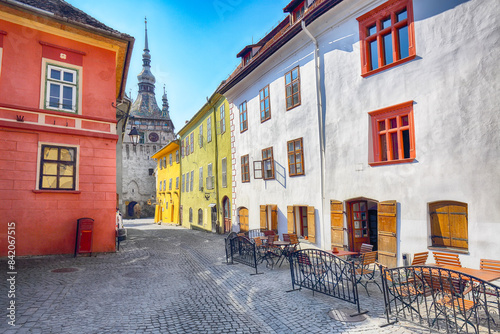 Amazing morning view of historic town Sighisoara and Clock Tower built by Saxons. photo