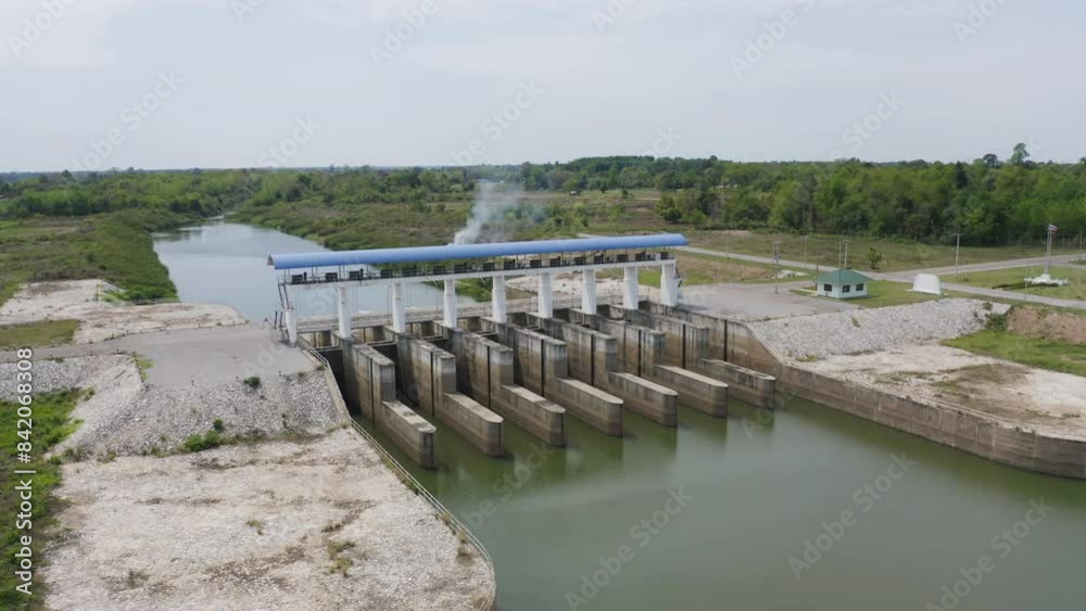 Aerial view of dam tower crane. Reservoir and sea water in recycle energy industry concept for electricity in Natural landscape background in Thailand. Environment. Aerial view of dam tower crane. Reservoir and sea water in recycle energy industry concept for electricity in Natural landscape background in Thailand. Environment.