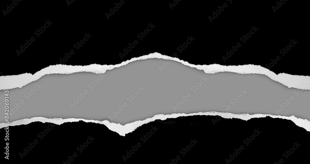 Ripped black paper on grey Ripped black paper on grey