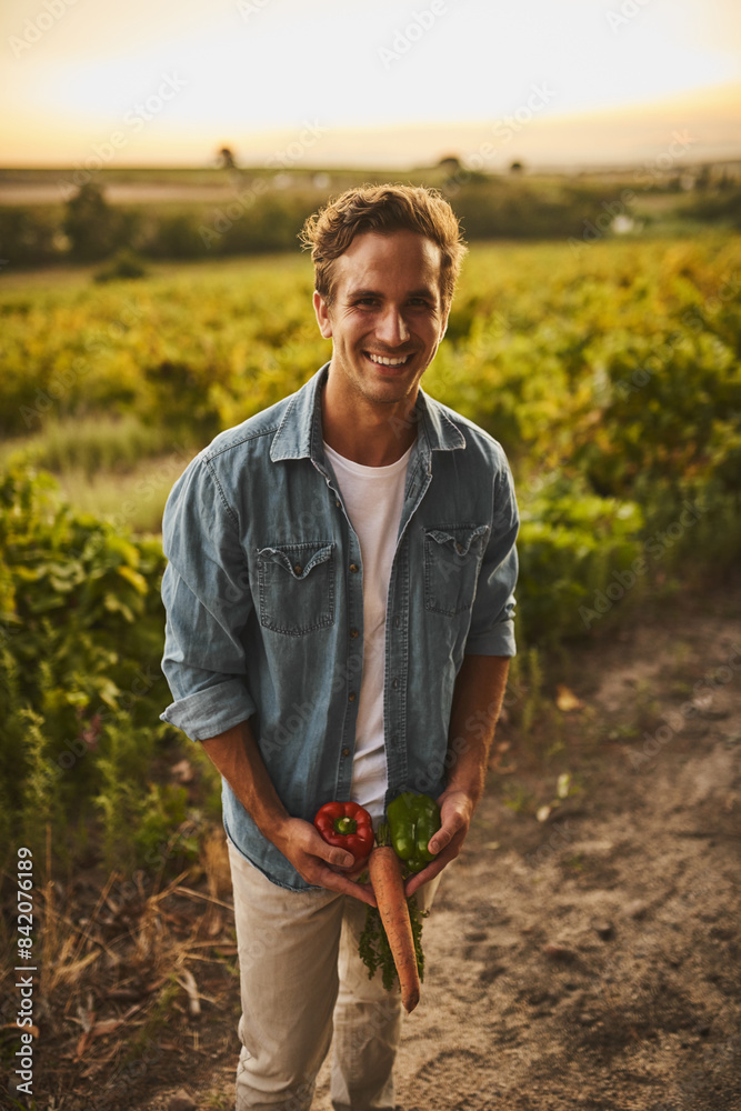 Man, portrait and produce on farm with laugh or happiness in sunset with pride for agriculture growth. Fun, goofy and silly in field or path for environmental conservation or ecology with peace Man, portrait and produce on farm with laugh or happiness in sunset with pride for agriculture growth. Fun, goofy and silly in field or path for environmental conservation or ecology with peace
