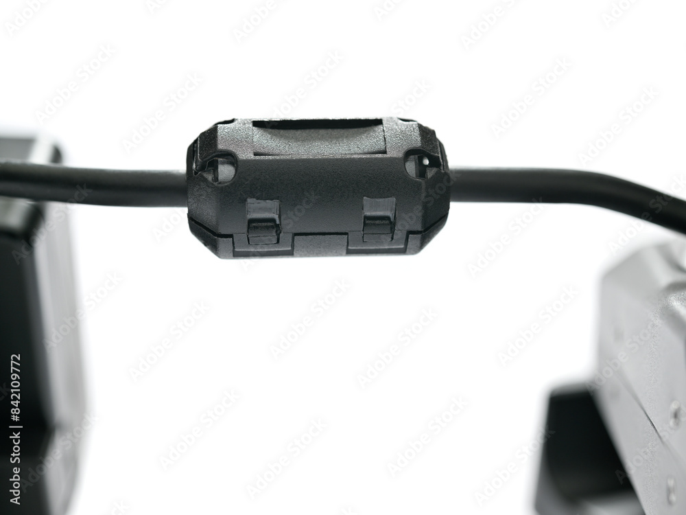 Close-up of a ferrite bead inductor on isolated white background Close-up of a ferrite bead inductor on isolated white background