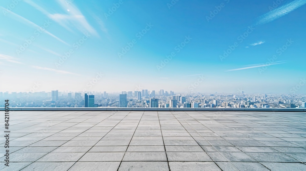 Fototapeta premium Spacious Rooftop with Panoramic Cityscape View Under Clear Blue Sky