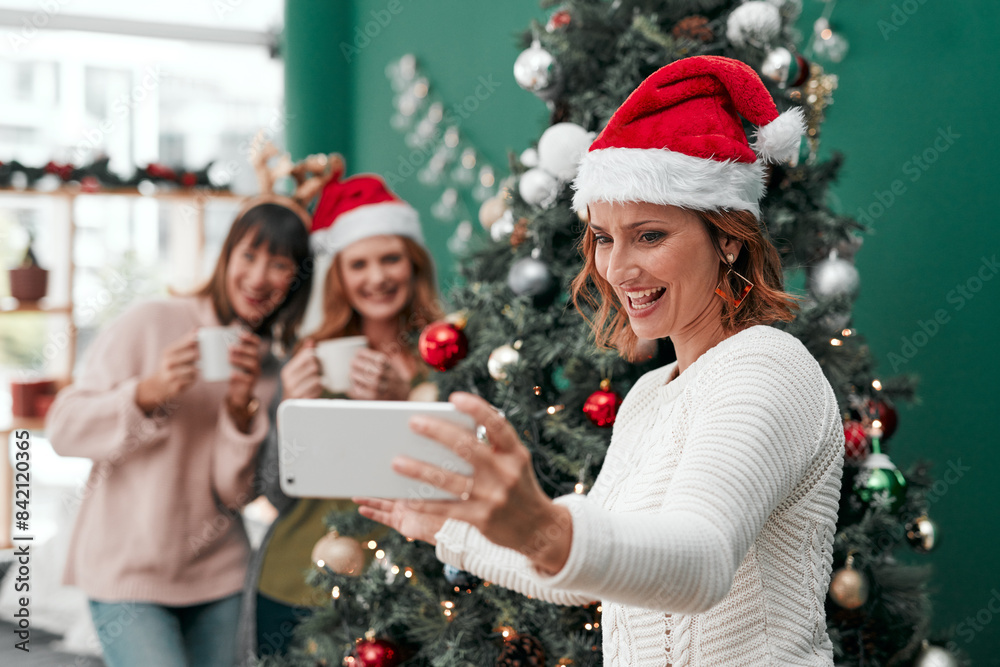 Woman, selfie and Christmas in living room for holiday, celebration and together with coffee. Technology, sisters and happy in family home for relax, vacation and drink in lounge for festive season Woman, selfie and Christmas in living room for holiday, celebration and together with coffee. Technology, sisters and happy in family home for relax, vacation and drink in lounge for festive season
