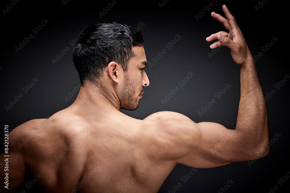 Flex, man and bodybuilder with muscles in studio for bicep strength or strong body on dark background. Back, arm and male athlete for development, workout results or muscular forearm on mockup Flex, man and bodybuilder with muscles in studio for bicep strength or strong body on dark background. Back, arm and male athlete for development, workout results or muscular forearm on mockup