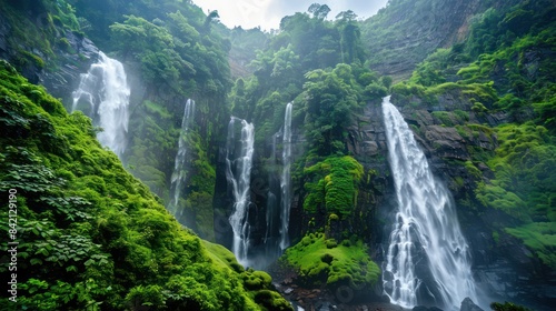 Beautiful waterfall on the plain. Mountain valley waterfall. view of waterfall in green valley