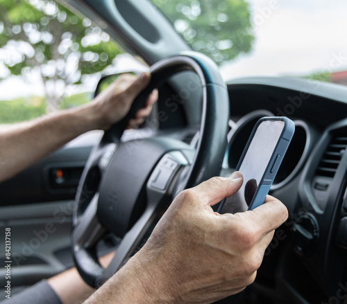 Man texting while driving square shot