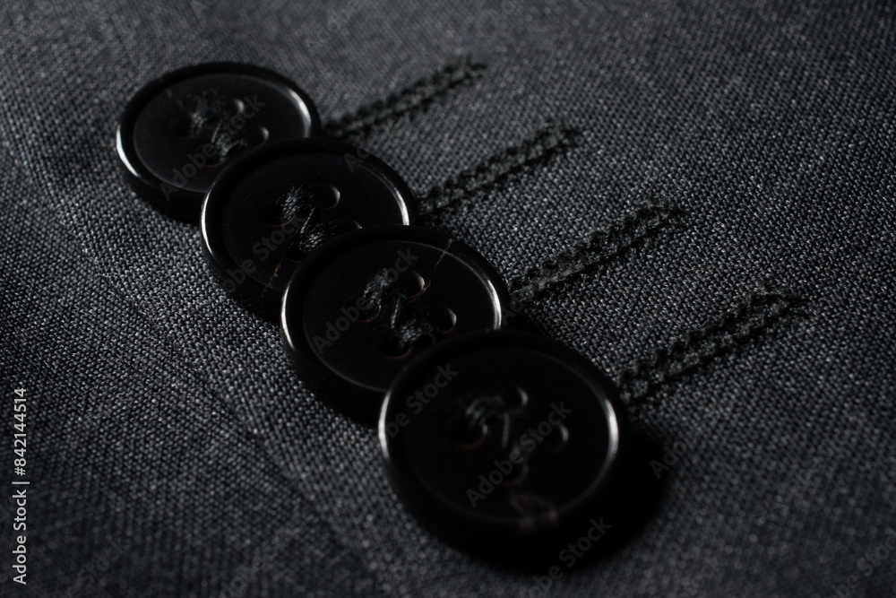 Buttons on men's jacket made of natural wool Buttons on men's jacket made of natural wool