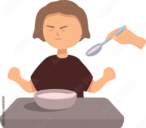 Little girl refusing food from parent at dinner table with angry expression on face
