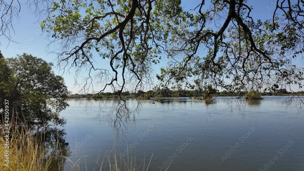 Zambezi River At Victoria Falls In Matabeleland North Zimbabwe. Giant Waterfalls. Nature Landscape. Victoria Falls At Matabeleland North Zimbabwe. Zambezi River. Travel Scenery. Zambezi River At Victoria Falls In Matabeleland North Zimbabwe. Giant Waterfalls. Nature Landscape. Victoria Falls At Matabeleland North Zimbabwe. Zambezi River. Travel Scenery.