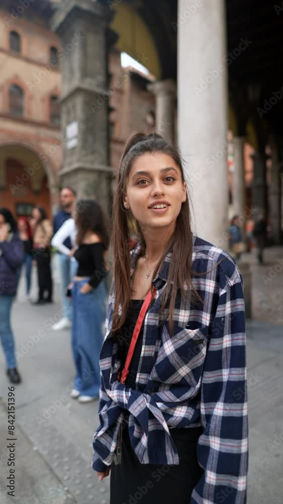 A woman filled with curiosity and a sense of discovery as she explores the city streets A woman filled with curiosity and a sense of discovery as she explores the city streets