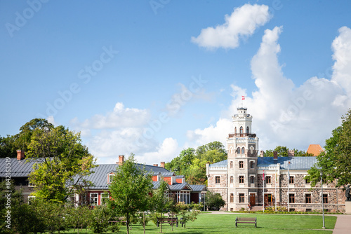 Main facade of the Sigulda new Castle with its tower and its garden. Built in 19th century by the kropotkin family it's neo gothic castle called Siguldas Jauna Pils in Sigulda, Latvia. photo