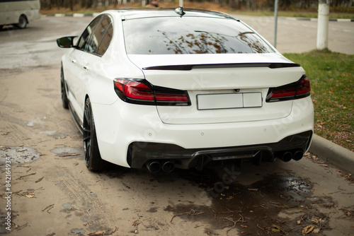 The car in the city. The car's on the street. Personal transport.