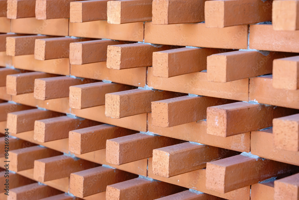 Background and Texture of Brick blocks or Red terracotta bricks. Beautifully arranged together with sunlight hitting them, creating dimension for the exterior building is modern architecture. Background and Texture of Brick blocks or Red terracotta bricks. Beautifully arranged together with sunlight hitting them, creating dimension for the exterior building is modern architecture.