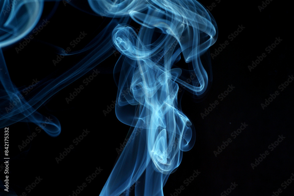 Close up of incense smoke abstract on black background Close up of incense smoke abstract on black background