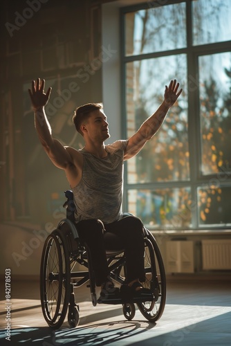 A Young man in wheel-chair doing exercises indoors