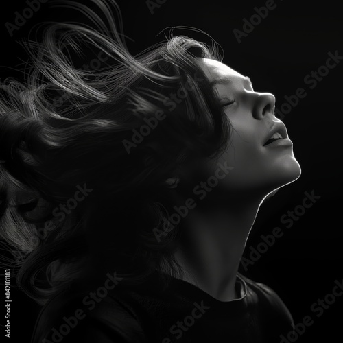 a woman with her hair blowing in the wind