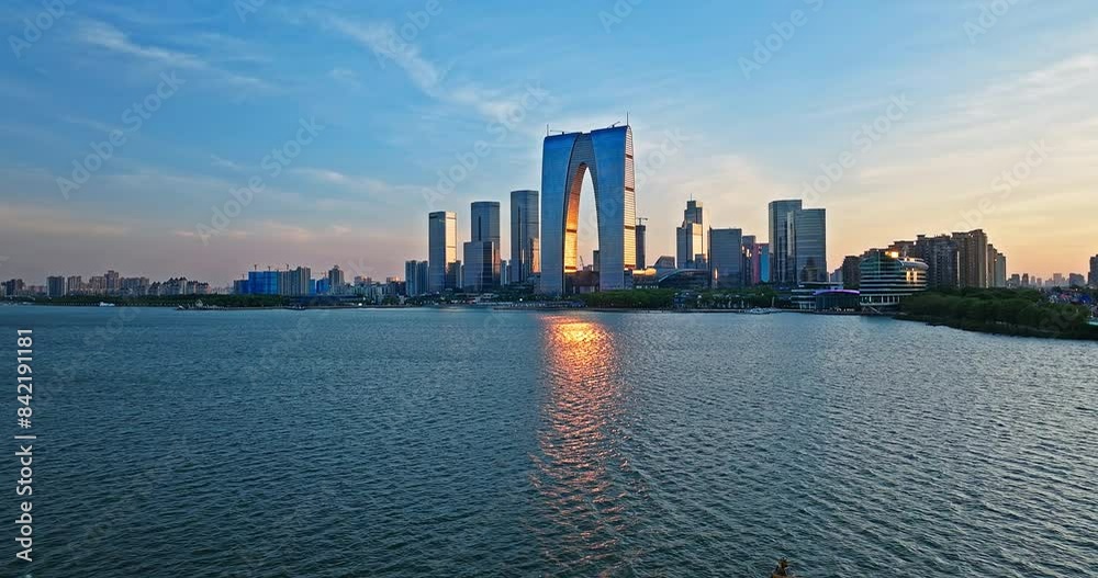 Modern city skyscrapers and natural scenery at sunset in Suzhou Modern city skyscrapers and natural scenery at sunset in Suzhou
