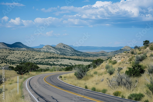 American landscape wallpaper route 66 road by mountains, a picturesque vacation scene providing copy space for personalized travel quotes and messages © Simn