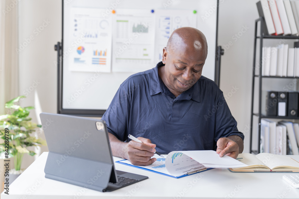 Creative african businessman senior american worker using computer device in office,chat online, thinking business solution planning difficult decision pondering strategy come up with idea. Creative african businessman senior american worker using computer device in office,chat online, thinking business solution planning difficult decision pondering strategy come up with idea.