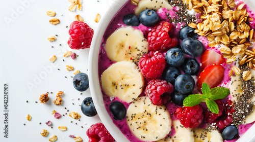 A high-definition close-up of a vibrant smoothie bowl topped with fresh berries, sliced bananas, chia seeds, and granola on a solid white background