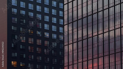Wallpaper Mural Glass modern office building time lapse. 4K time lapse video with the sunset reflection in the glass wall of an office headquarters corporation building. Concept video for business working schedule. Torontodigital.ca
