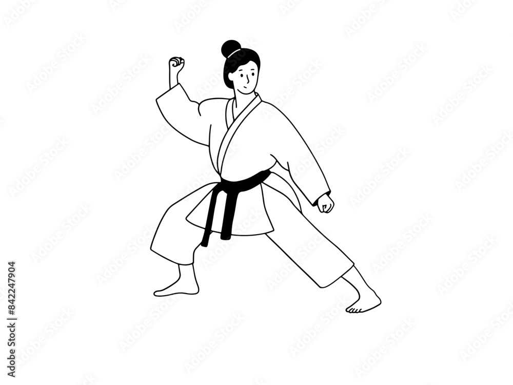 Fototapeta premium Young woman doing karate