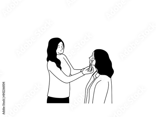 Make up artist putting on a woman's face in beauty salon