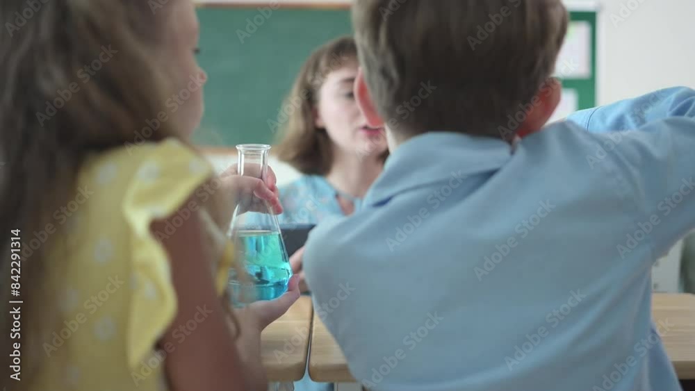 Teacher and students, Learn and experiment with science in a school science classroom. Teacher and students, Learn and experiment with science in a school science classroom.