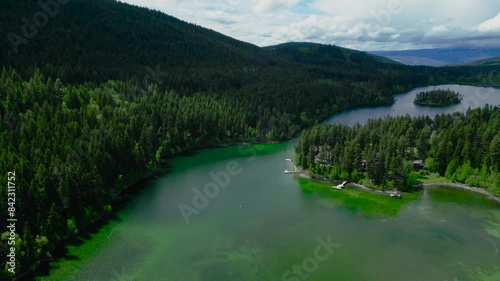 Wallpaper Mural Aerial video from a drone: Mountain lake, boat fishing, pine forest, forest homes with docks in Canada Torontodigital.ca