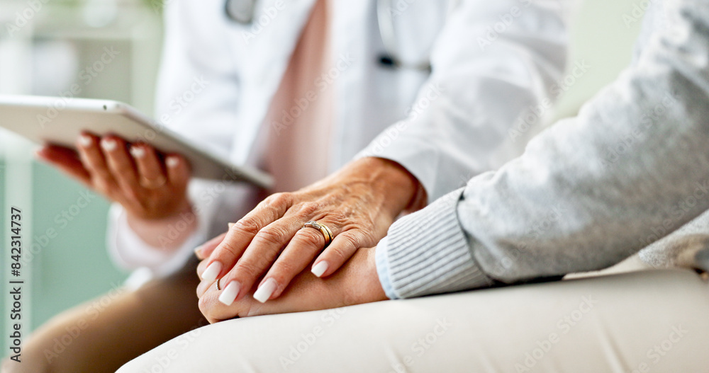 © peopleimages.com - Doctor, patient and holding hands with tablet in consultation with support, empathy and announcement. Medic, person and touchscreen with comfort, diagnosis or app with healthcare service at hospital