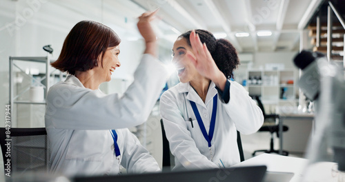 Women  high five and laptop in lab for science  notification or celebration for research project. People  scientist and lab partner by computer for cheers  excited or results for funding application