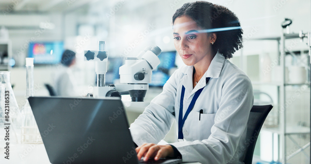 Laptop, woman and scientist with research in laboratory for medical innovation with biotechnology. Science, computer and female biologist typing online for pharmaceutical experiment in office. Laptop, woman and scientist with research in laboratory for medical innovation with biotechnology. Science, computer and female biologist typing online for pharmaceutical experiment in office.