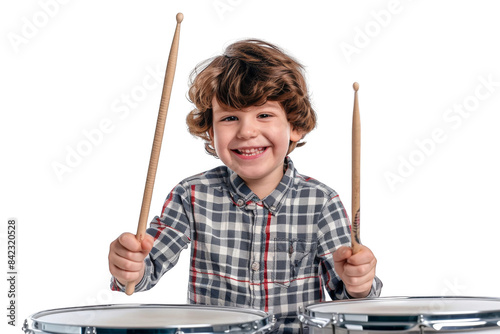 happy young boy playing on drumsticks, isolated in white background. photo