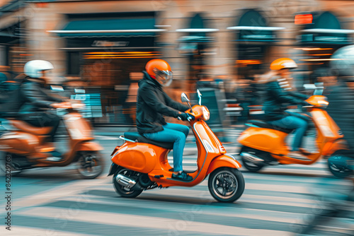 Scooter being ridden in a group of scooters, urban transportation © Emanuel