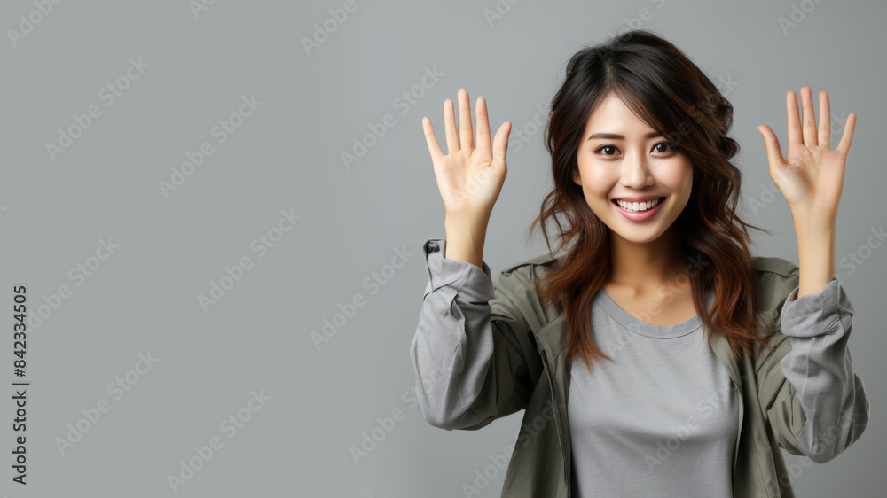 Japanese woman smiling in casual apparel with welcome gesture greeting isolated Japanese woman smiling in casual apparel with welcome gesture greeting isolated