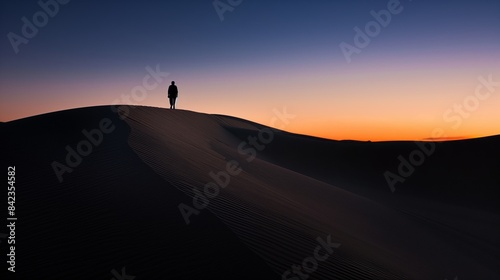 A solitary figure wanders across endless desert dunes under twilight  a silhouette against the fading light.