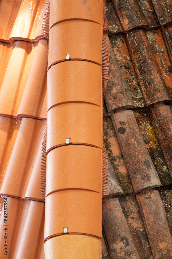 difference between clean roof tiles and dirty after the passage of industrial high-pressure jet difference between clean roof tiles and dirty after the passage of industrial high-pressure jet