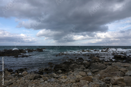View of the rocky beach on a cloudy day