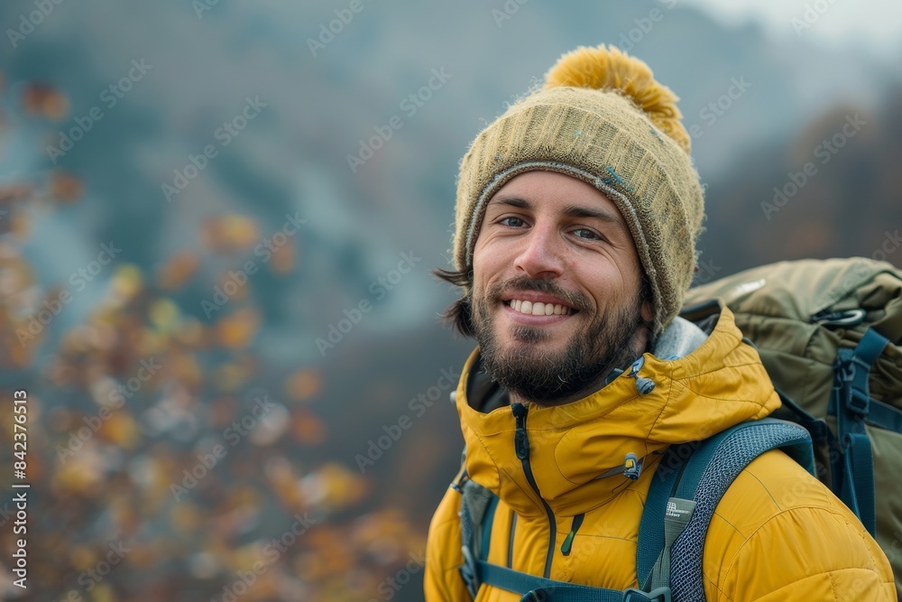 portrait of a smiling male hiker with a backpack in the mountains portrait of a smiling male hiker with a backpack in the mountains