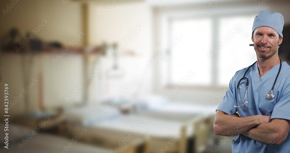 Fototapeta premium Image of caucasian male doctor over hospital