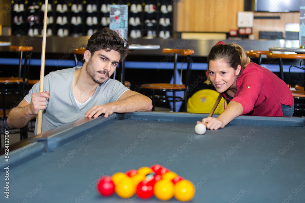 couple playing billiards and bonding couple playing billiards and bonding