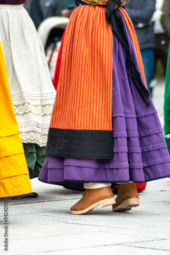 women dressed in the traditional costume of Galicia dancing to popular music, folk event photo