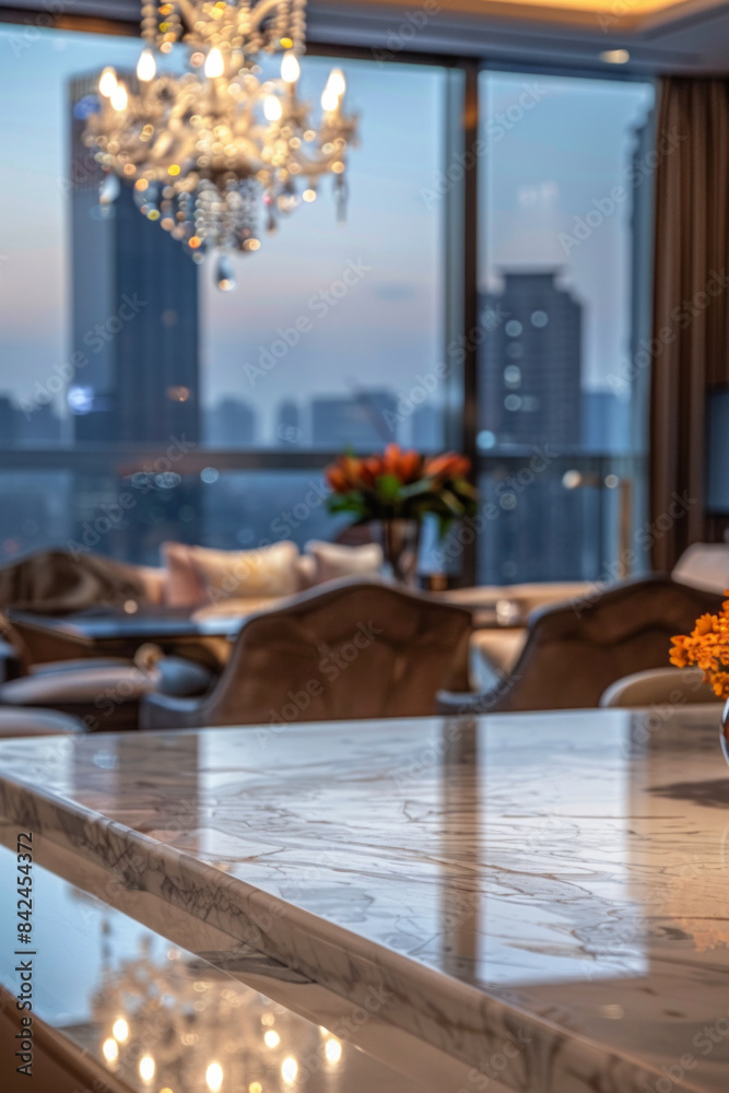 An elegant, polished marble dining table in the foreground with a blurred background of a luxury hotel penthouse suite. An elegant, polished marble dining table in the foreground with a blurred background of a luxury hotel penthouse suite.