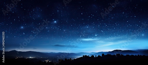 Night landscape photography featuring Comet Neowise and stars in the sky with a clear view of the copy space image.