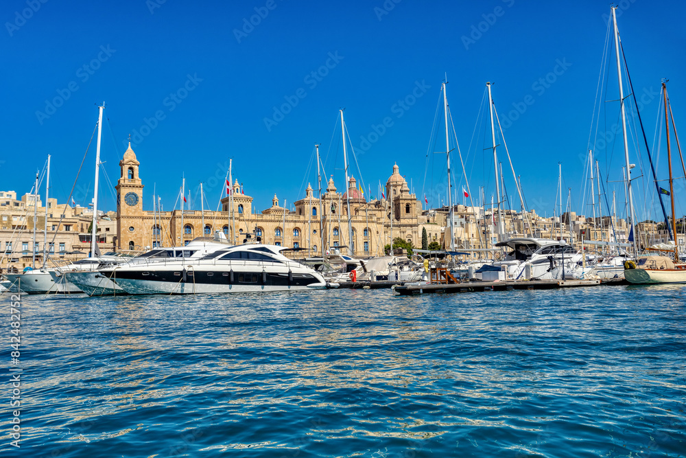 Medieval Malta: Birgu and Vittoriosa waterfront, Malta, features iconic churches, historic buildings and luxury yachts in Malta. Cultural heritage of Malta Medieval Malta: Birgu and Vittoriosa waterfront, Malta, features iconic churches, historic buildings and luxury yachts in Malta. Cultural heritage of Malta