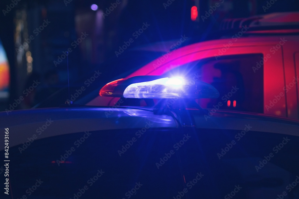 Obraz premium Police car in the city at night.